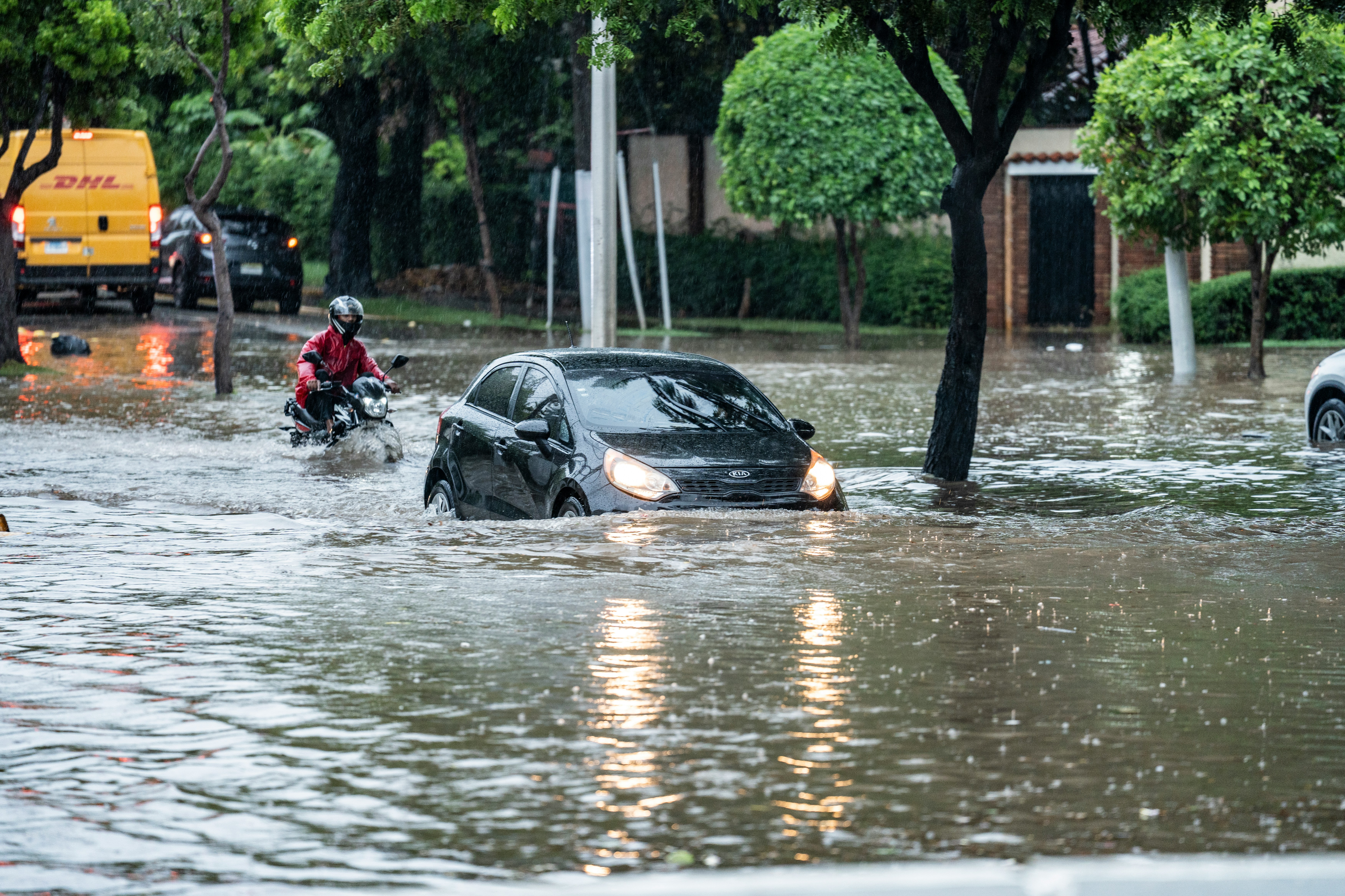 car partially submerged in flooded waters